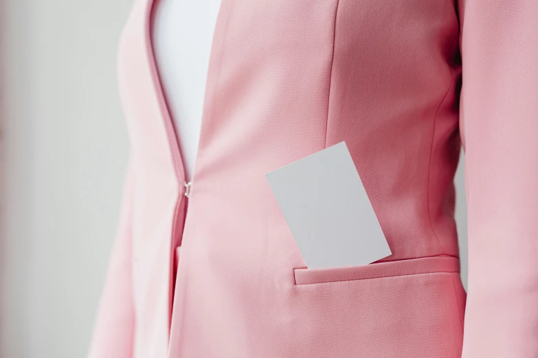 a pink suit jacket with an empty tag on the side