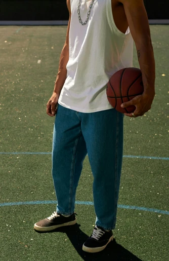 a person wearing white shirt holding a basketball