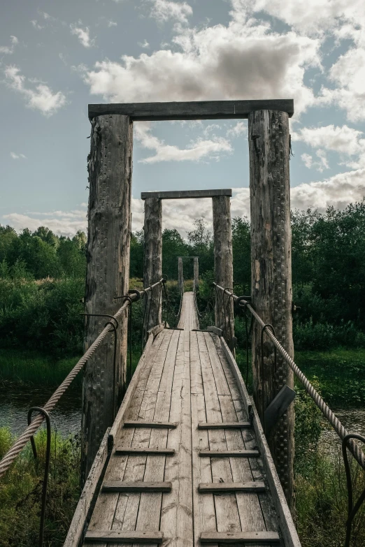 the walkway bridge crosses a body of water