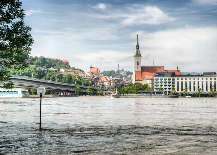 a view of a river with buildings in the background