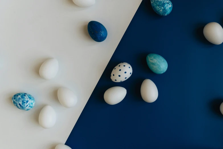 blue and white colored rocks are on top of a counter