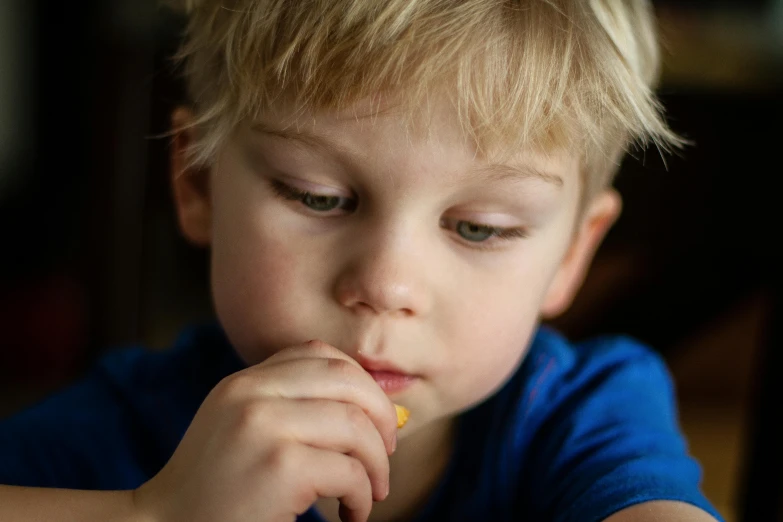 a young child who is eating food