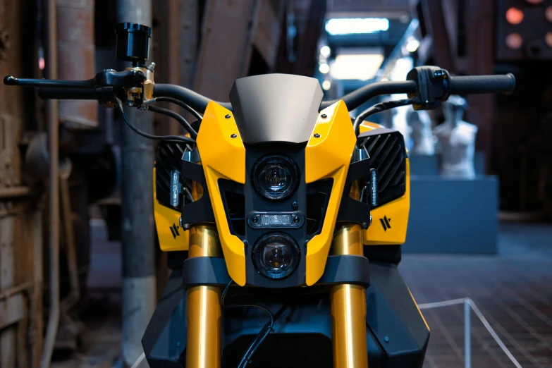 the front view of a yellow and black motorcycle