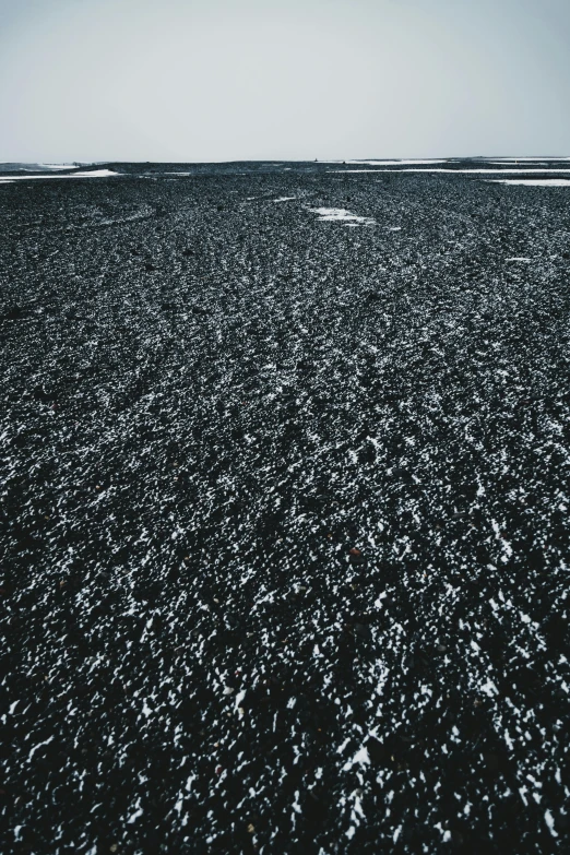 a small boat in the middle of an empty ocean