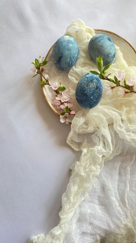 some strange blue chocolate candies on a white lace