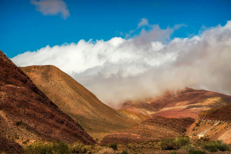 some mountains with a lot of cloud covering them