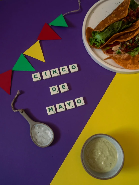 some letters and plates of food on a table