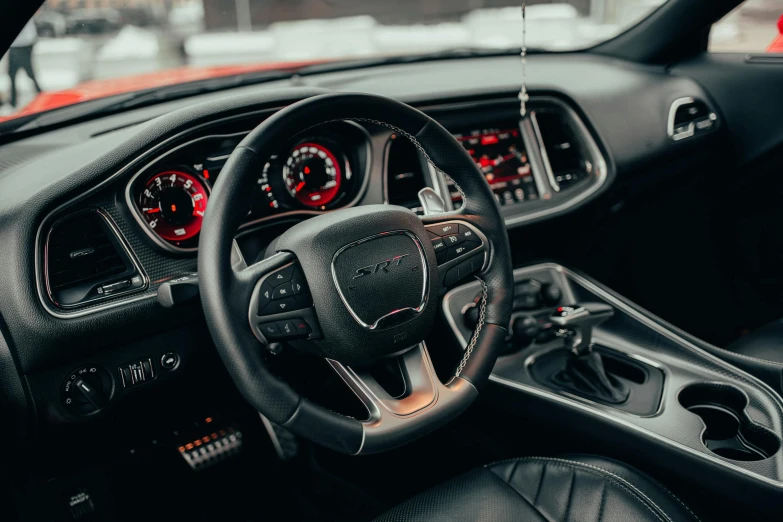 a black car dashboard with two dash lights