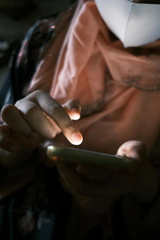 a close - up of someone holding and touching their cellphone