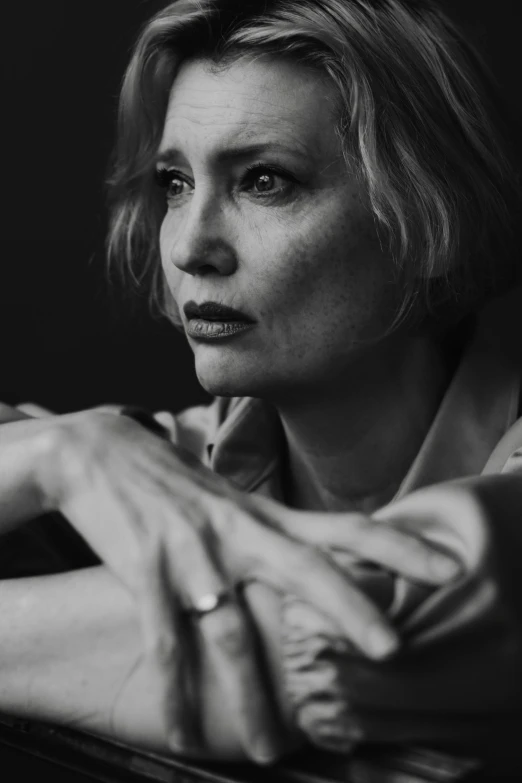 woman with short hair sitting on the table