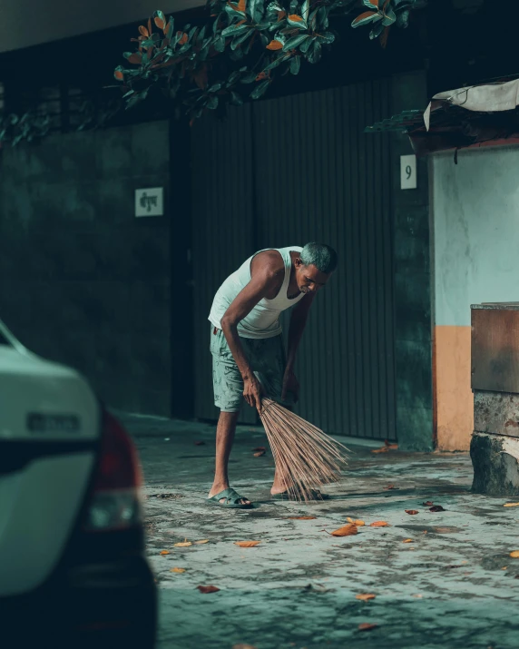 the man is sweeping through a small area