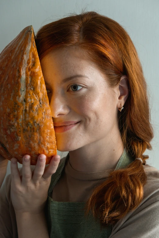 a woman holding a piece of pizza in her hands