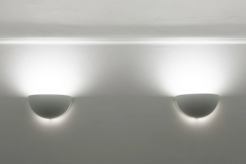 three lights that are on the wall