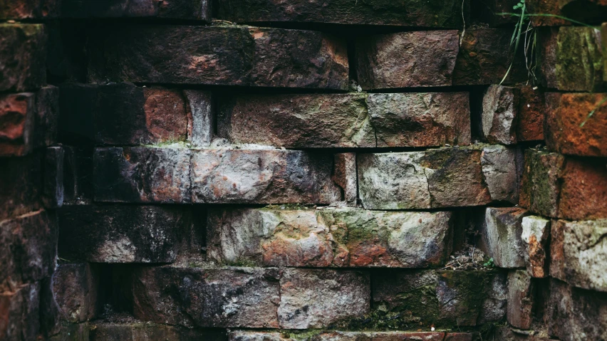 a large brick wall with different colors