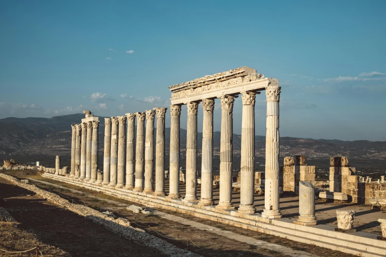 there is an old pillar with roman columns