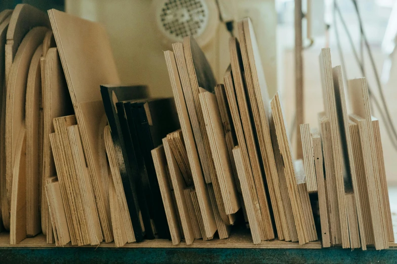 several pieces of wood sit on a shelf