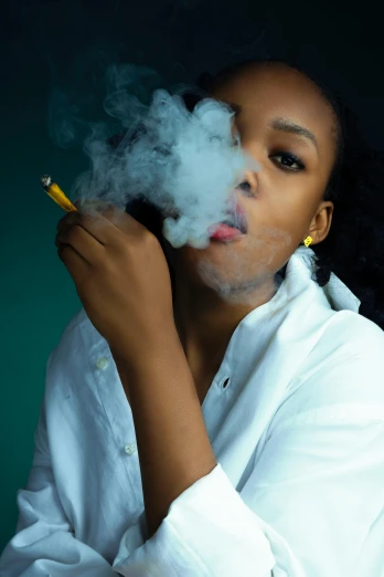an african american woman smoking electronic cigarette