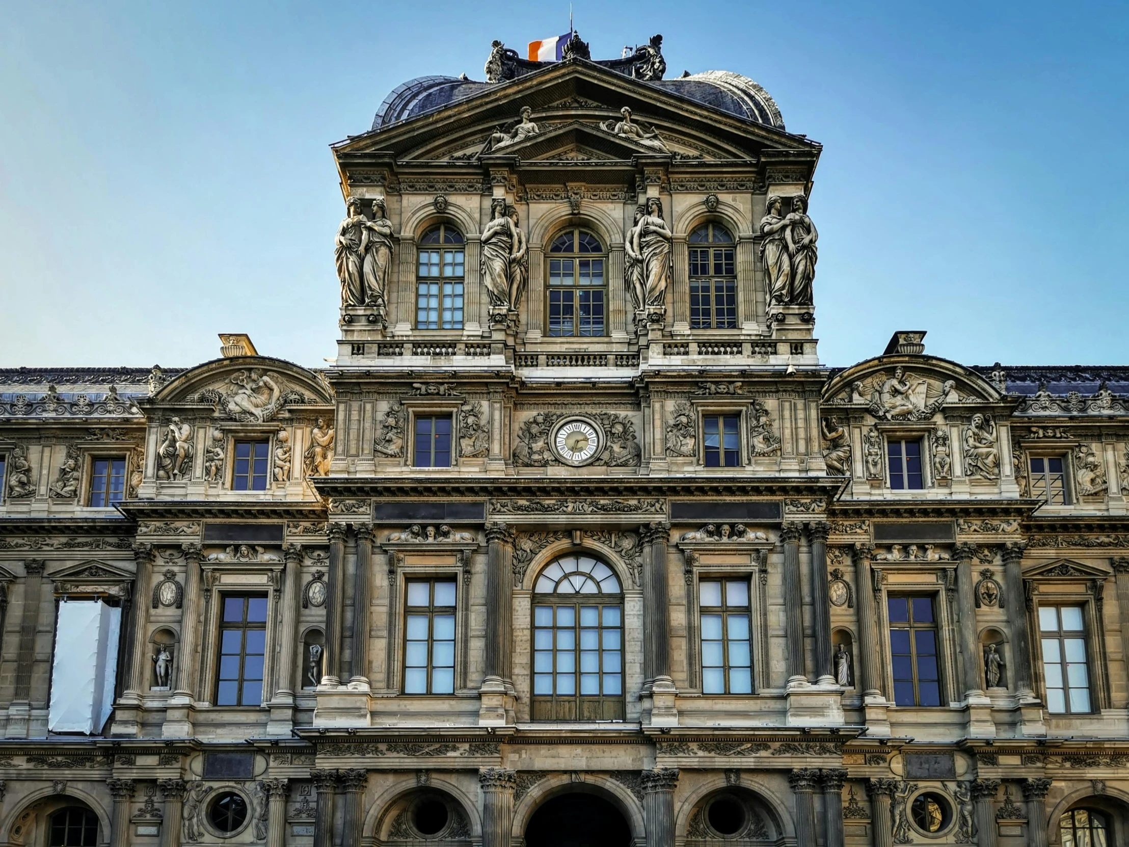 a close - up view of a building with ornate stucco and stone architecture