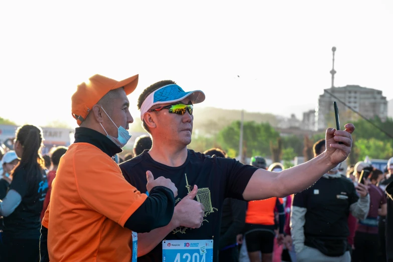 two men wearing hats are pointing guns at someone else