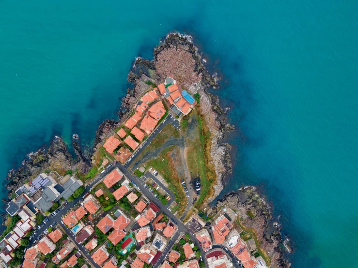 a sea view of a small city near some water