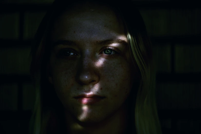 a woman is shown with green eyes and a dark background