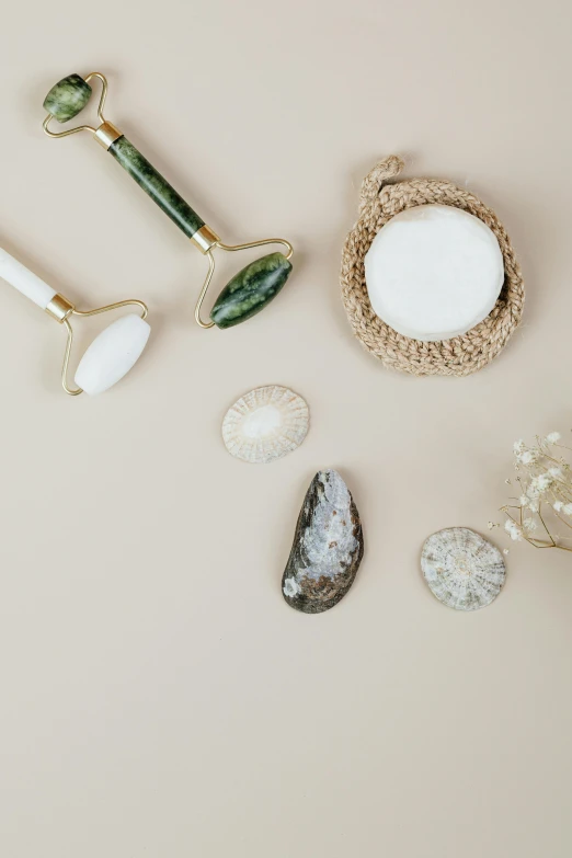 an assortment of accessories and stones on top of a table