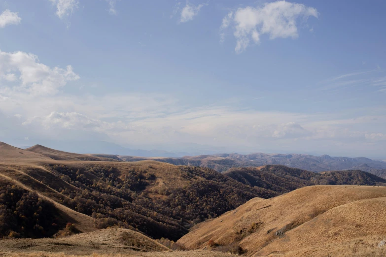 a beautiful mountainous area with brown hillside