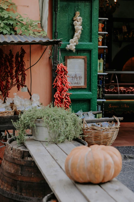 a store with some pumpkins outside in front