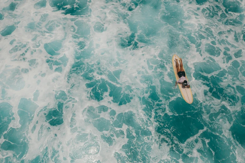 a person riding a surf board on top of water