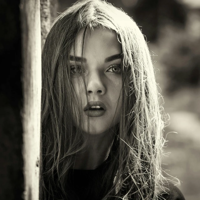 black and white pograph of a young female on her way to the woods