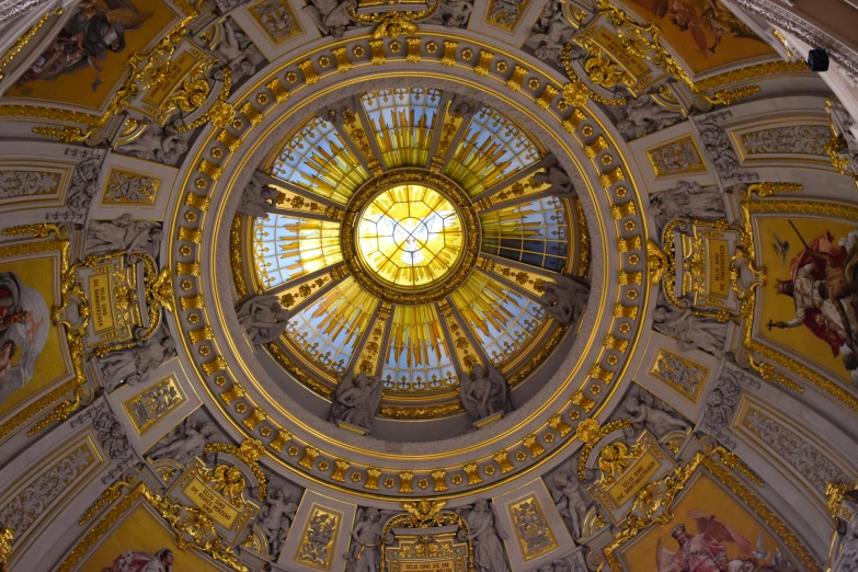 a dome has many paintings and sculptures on it