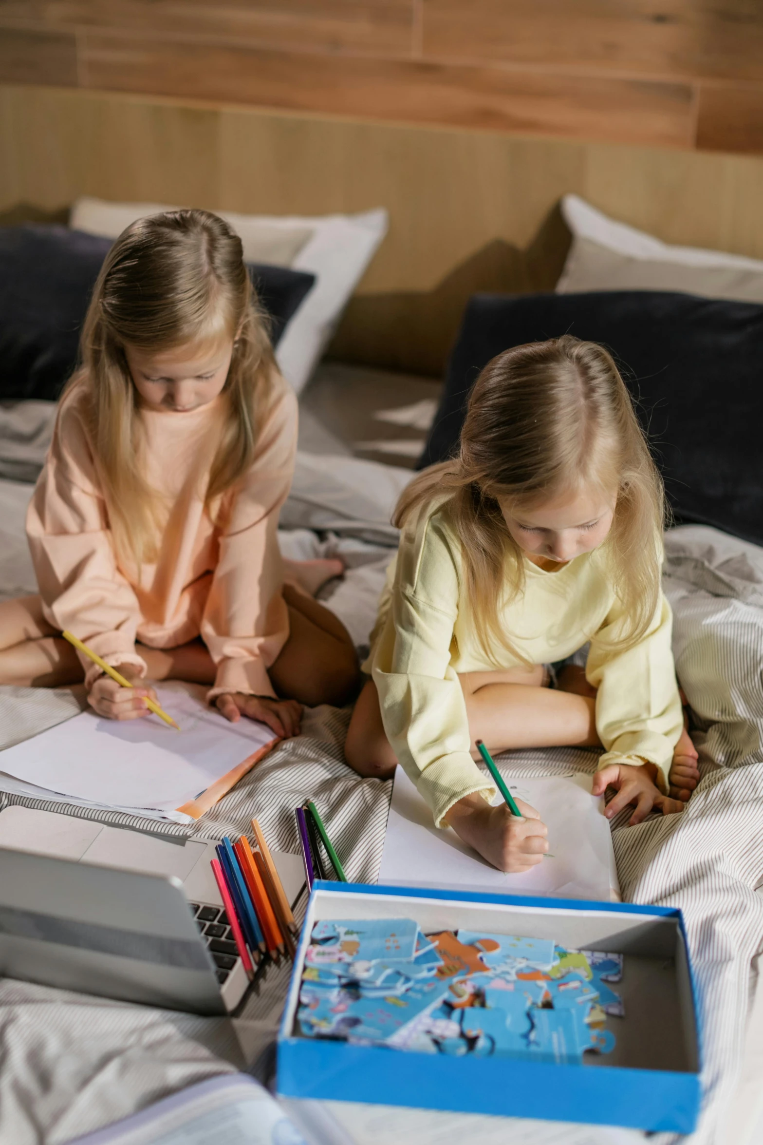 two little girls that are sitting down together