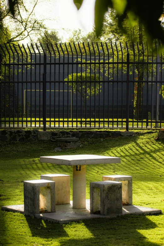 a bench in a park with grass in front of it