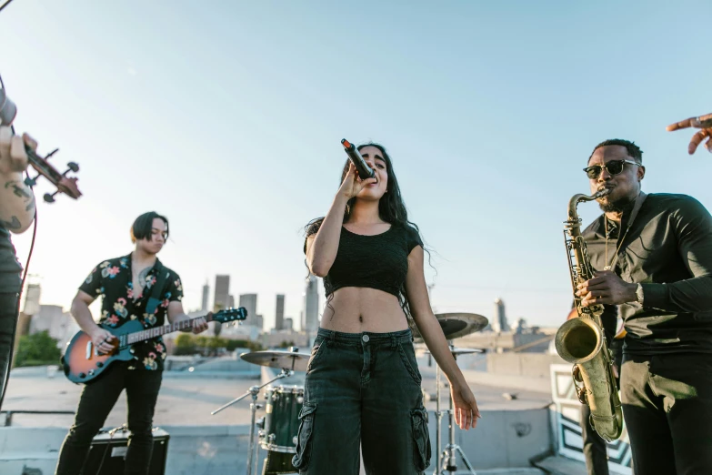 a band of people are performing together on stage