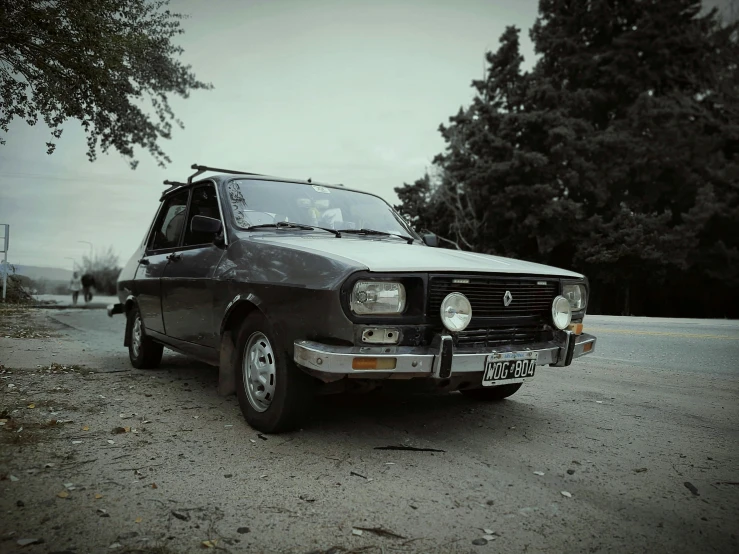 a black and white po of a parked old car