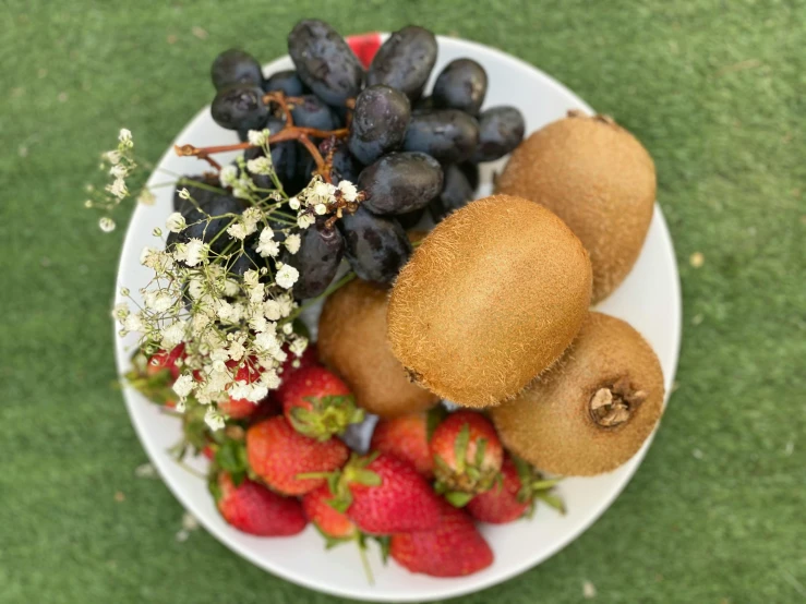 a plate topped with sliced fruit and other vegetables