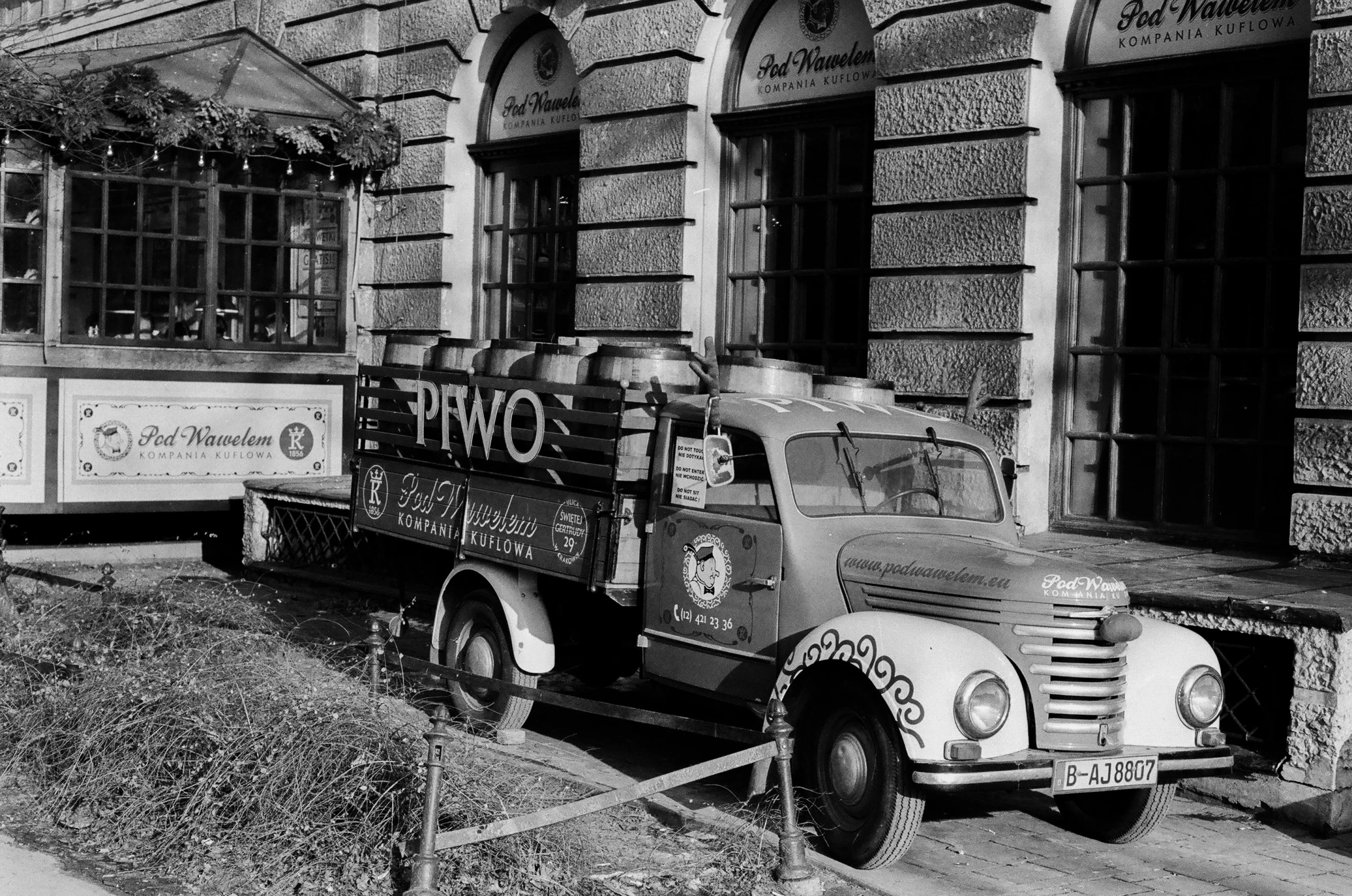 a trolley car sits in front of a building