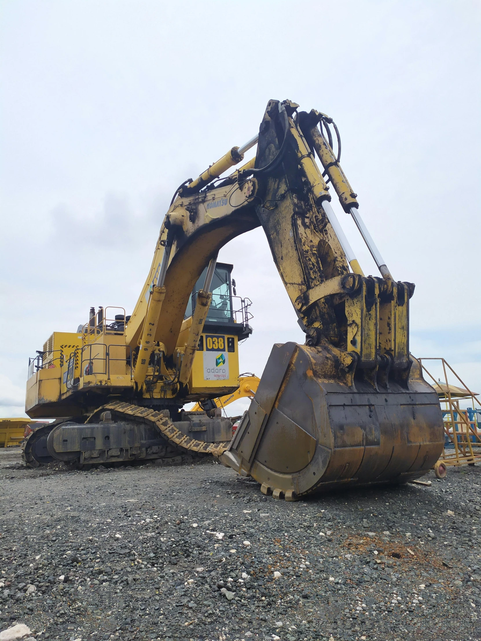 an image of backhoes at work on a construction site