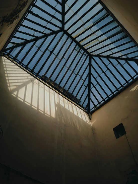 a roof of windows with a skylight behind it