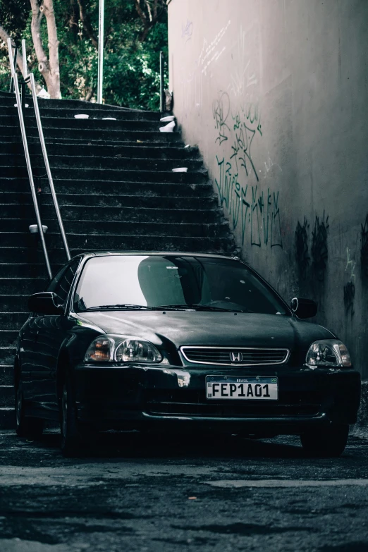 a car that is sitting in front of some steps