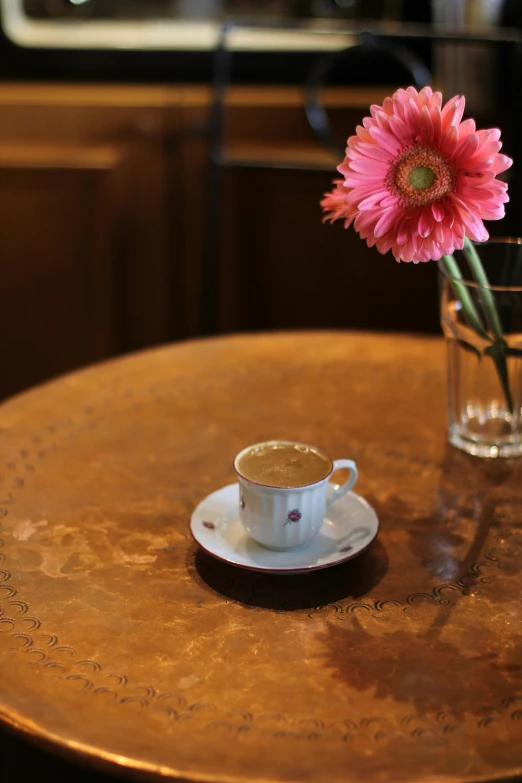 a plate with a flower and some water