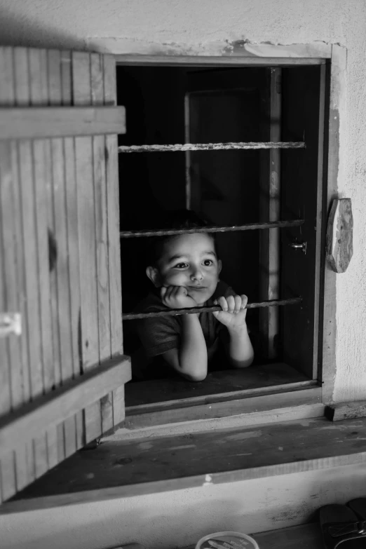 a child looking out the window at soing