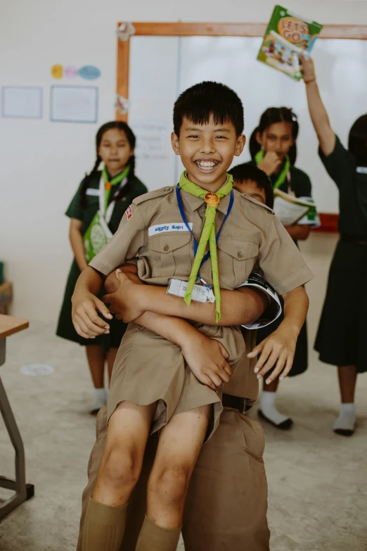 two children who are smiling and hugging each other