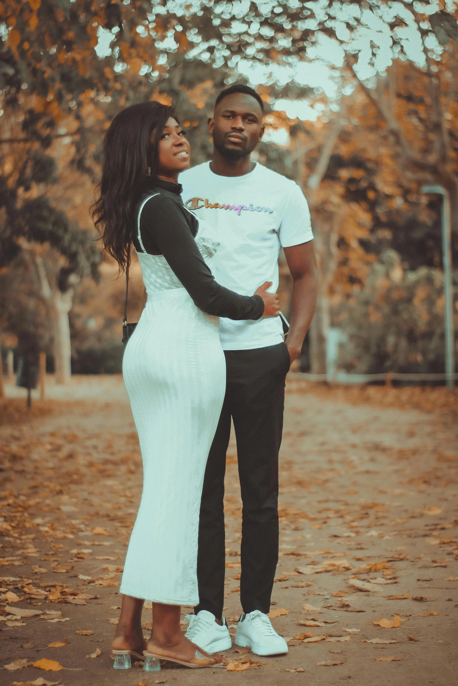 a black man and woman are standing next to each other