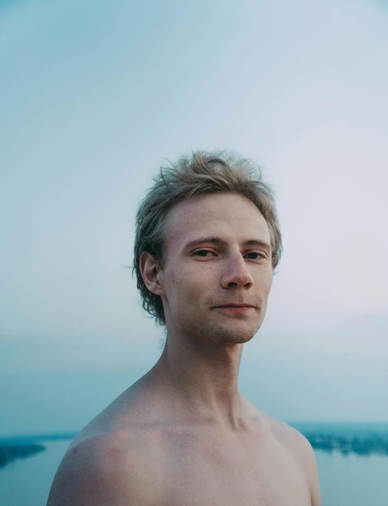 a man standing in front of the ocean