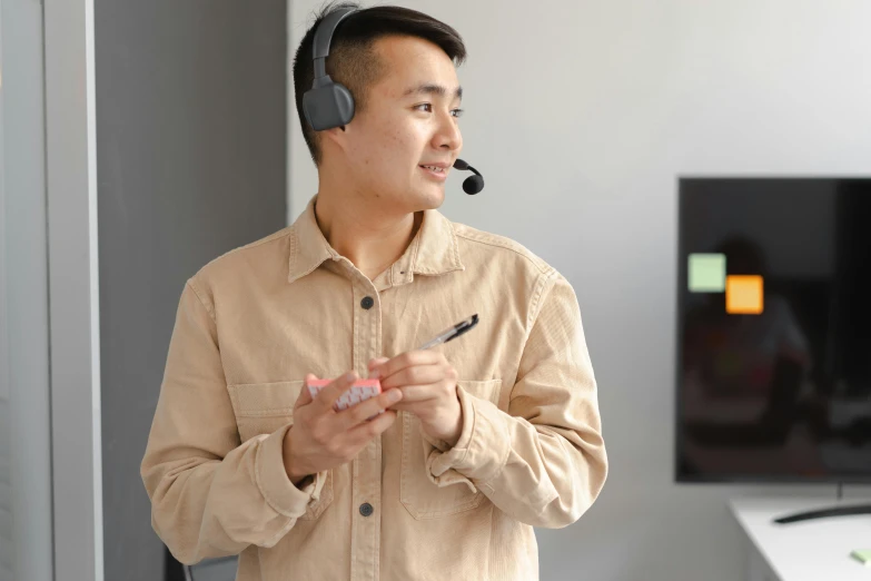 a man with headphones on is talking in a conversation