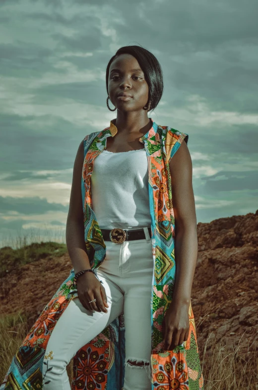 a woman poses for the camera in the field