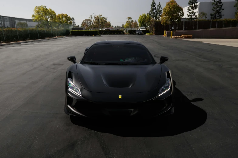 a black car parked on the side of a road