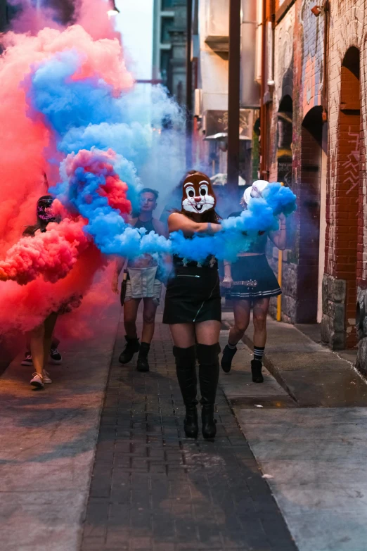 several people in costume are standing on a city street