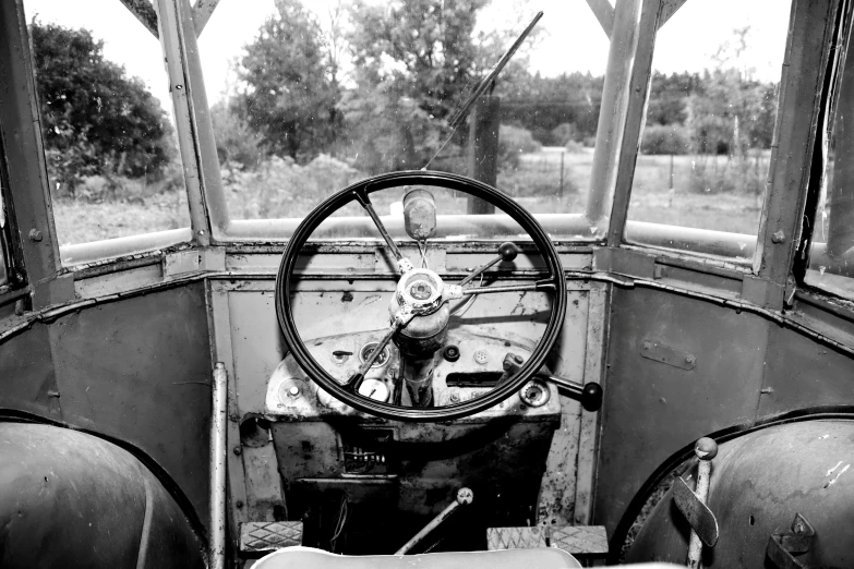 a very old, rusty vehicle sitting in a field